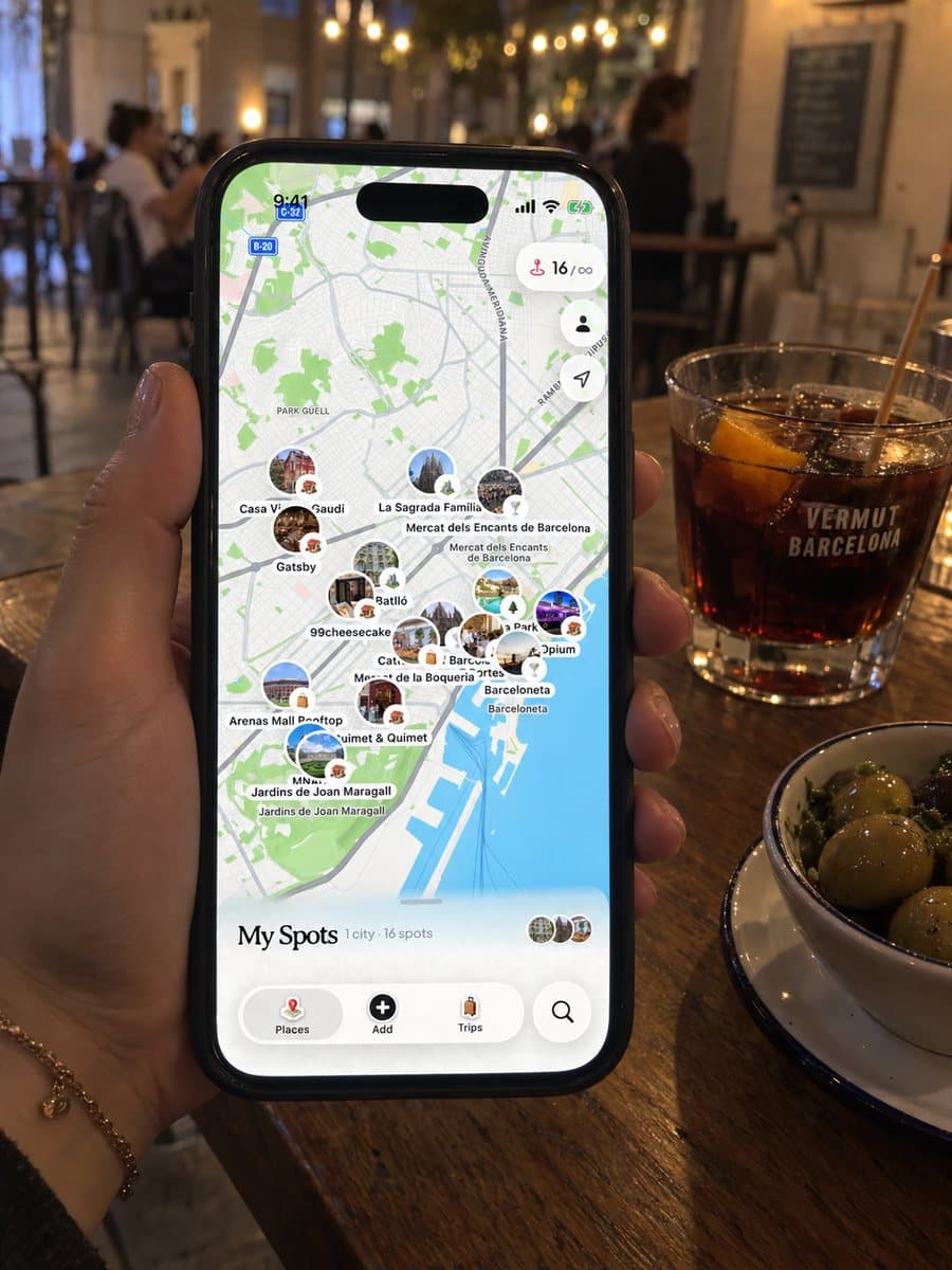 Dream Trip open on an iPhone in Barcelona, with saved spots pinned on the city map