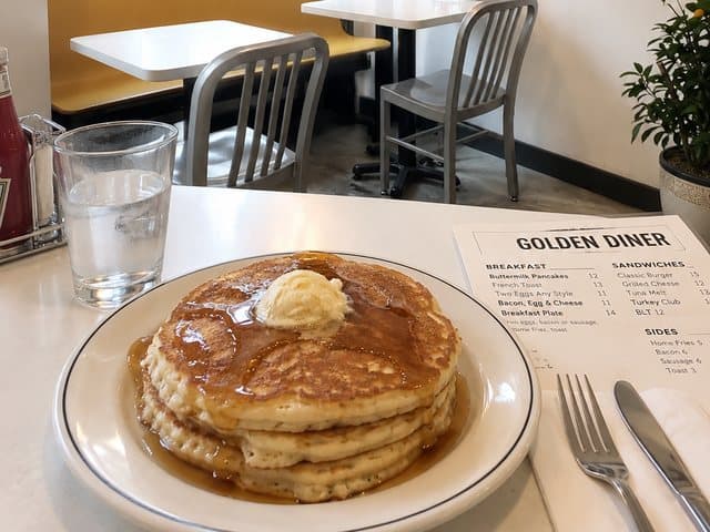 Pancakes with butter and syrup at Golden Diner