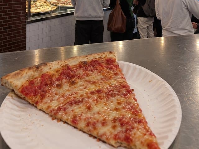 A New York cheese slice at Prince Street Pizza