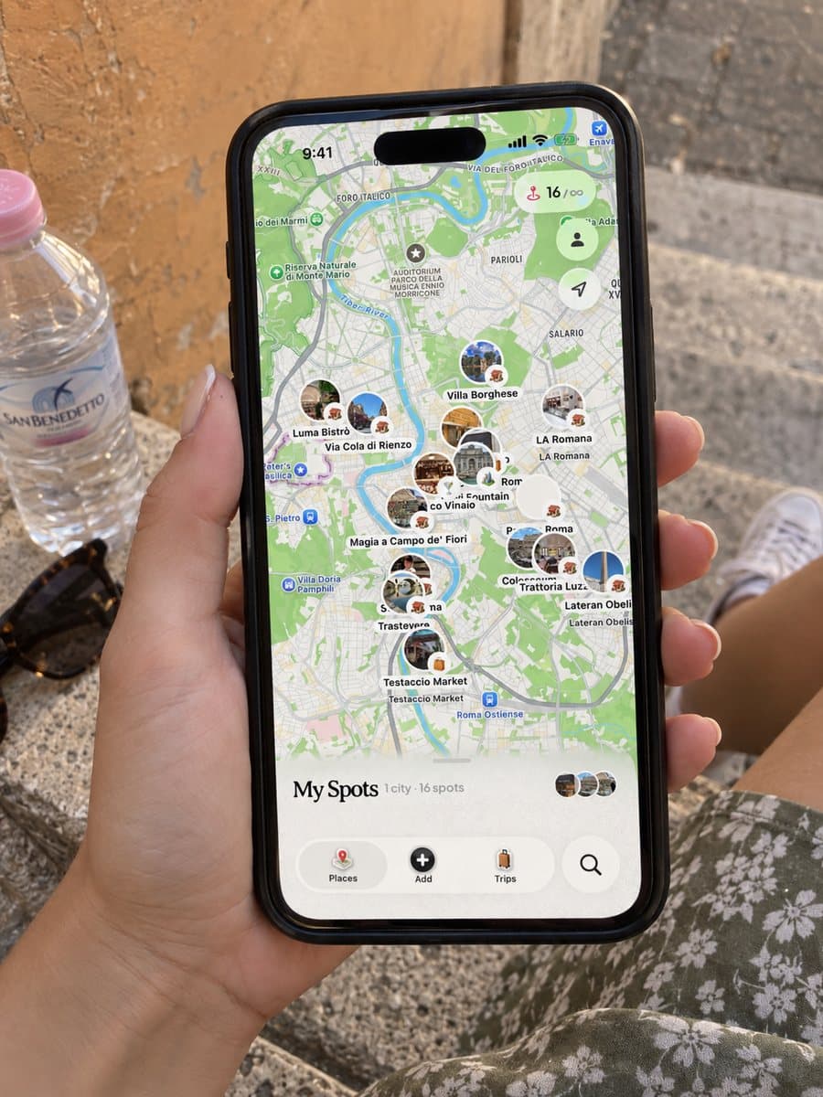 Dream Trip open on an iPhone in Rome, with saved spots pinned on the city map